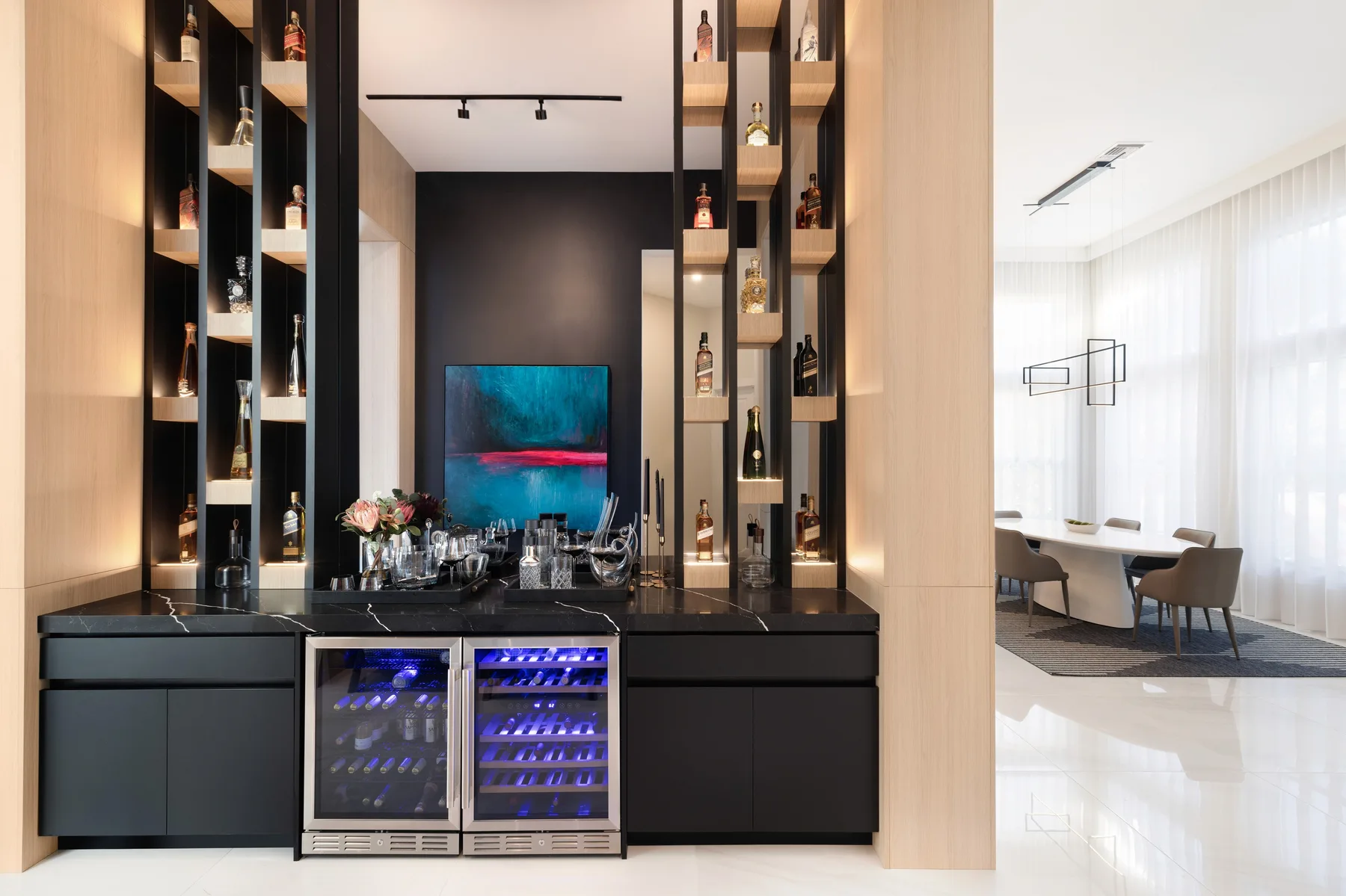 HOME DR bar with black cabinetry, lit bottle shelving, wine storage and a stone counter