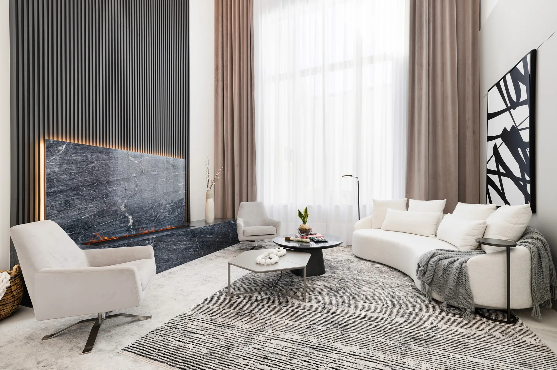 Living room with a dark marble fireplace wall and white sofas against soft drapery