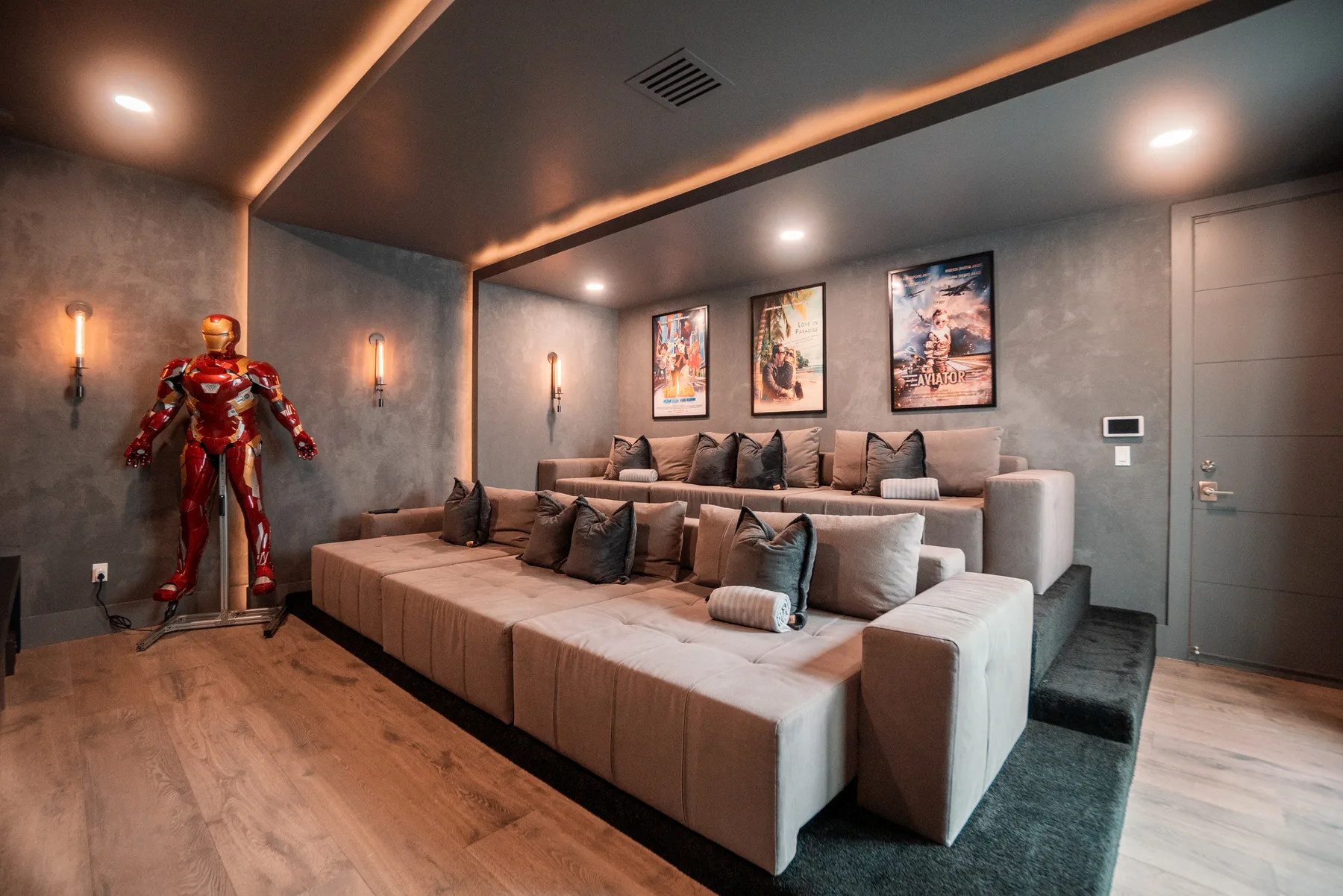 Media lounge with a framed TV wall and deep sectional seating