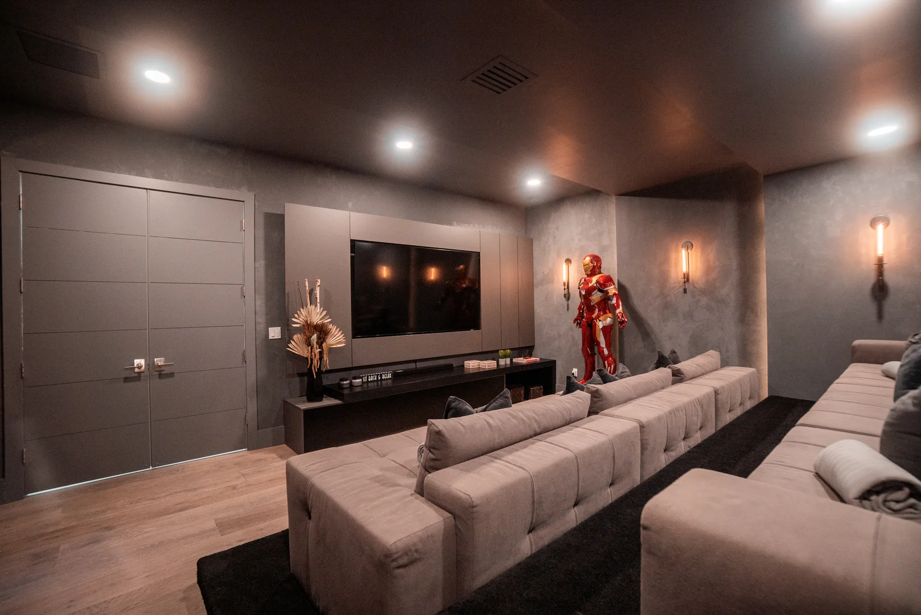 Screening room with deep sectional lounge seating facing the screen