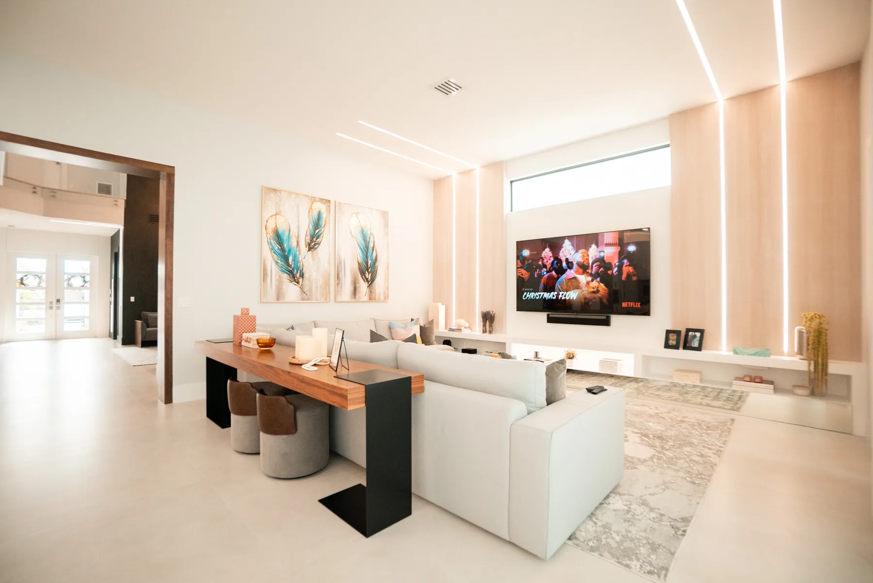 Wide view of a game room with a billiards table and a turquoise lacquer bar
