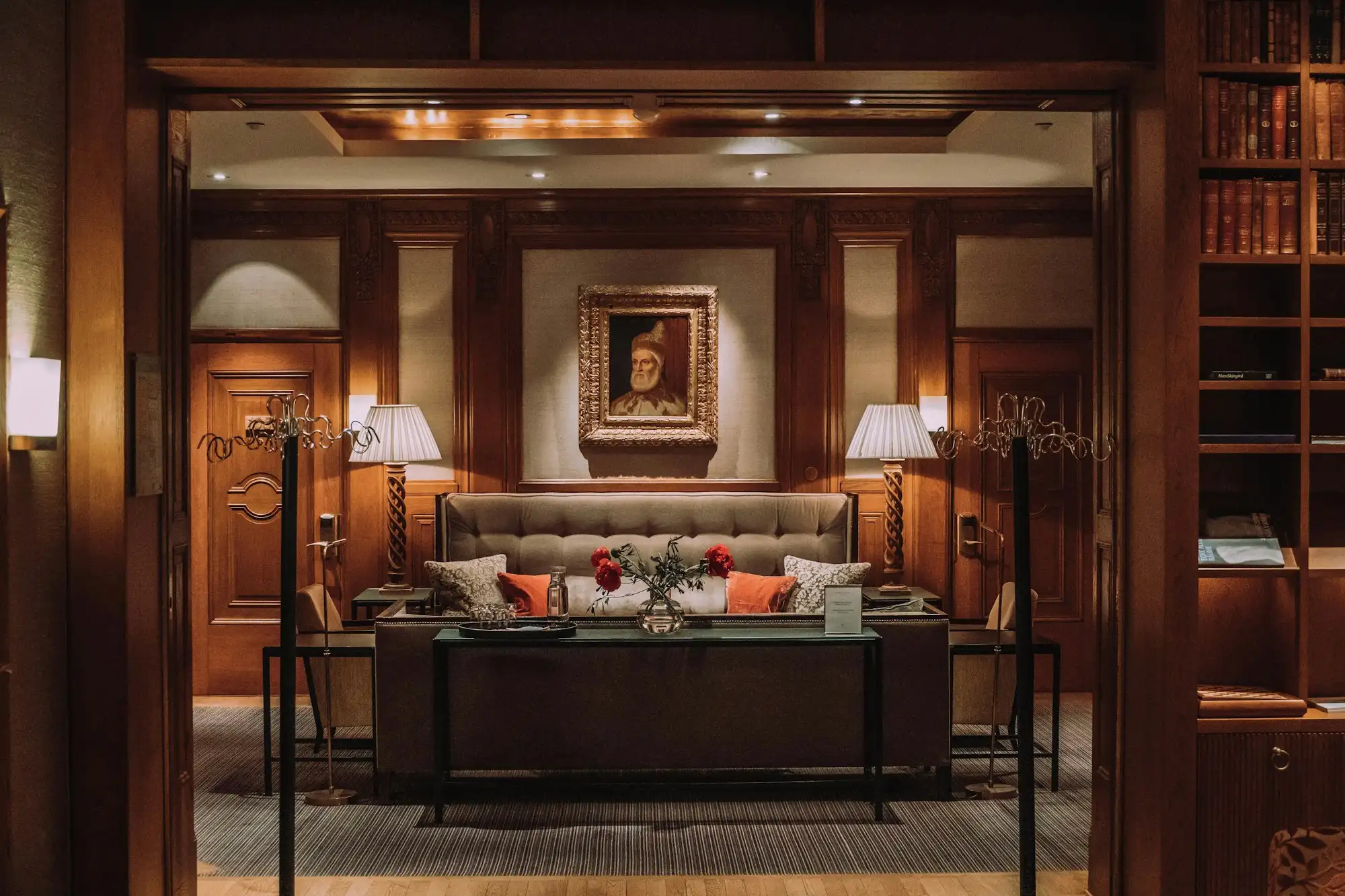 Boutique hotel lounge in Miami with layered lighting and custom banquette seating
